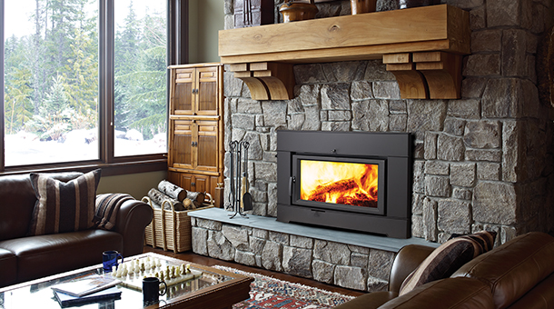 Regency Ci2600 Wood Fireplace Insert with dark stone surround and hearth in living room