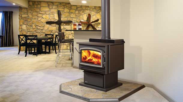 Regency large standing wood stove fireplace on stone platform